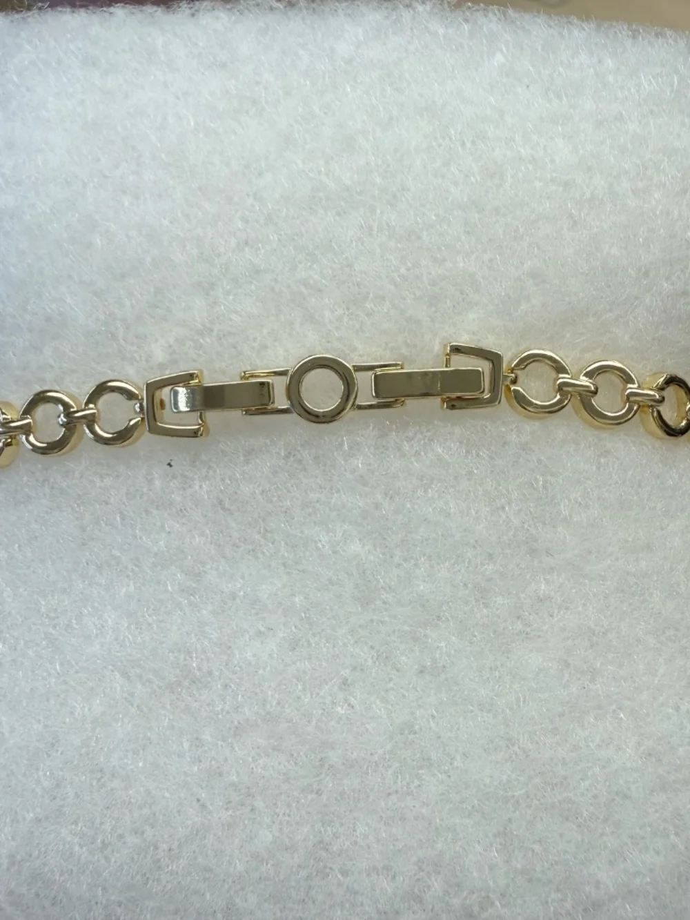 Gold open circle bracelet with CZ flower and circle pave accents